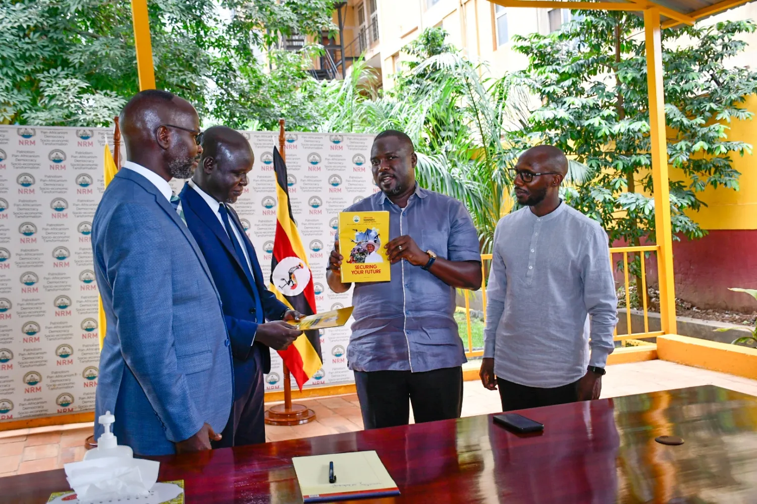 Hon. Ojara Martin Mapenduzi Signs MoU with ruling National Resistance Movement party